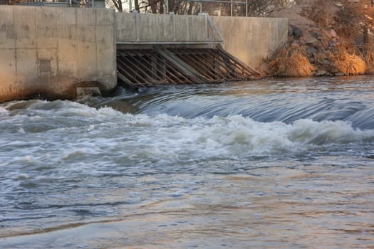 dam and irrigation ditch inlet with a headgate on South Platte River, Colorado