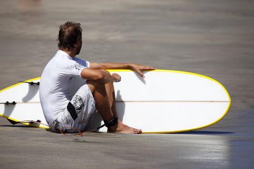 Surfer on a coastline expecting the big wave. Bali
