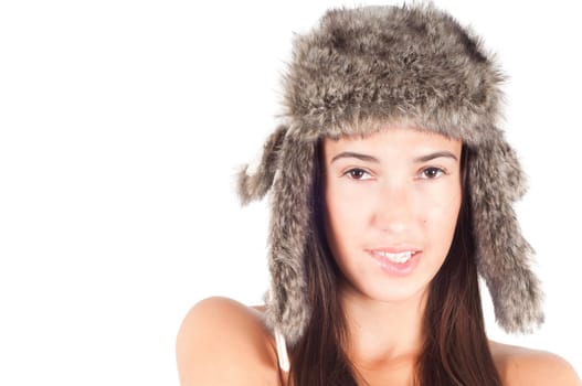 Studio shot of beautiful woman in fur hat