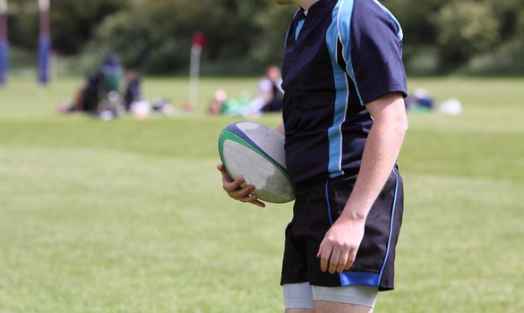 rugby player holding the ball