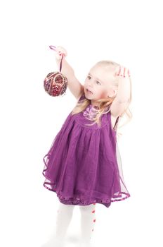 Studio shot of baby girl in lilac gala dress