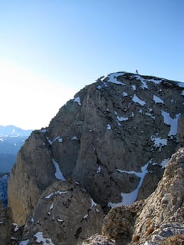 Lifting; the man; the guy; rocks; a relief; a landscape; a hill; a panorama; mountains; caucasus; top; a slope