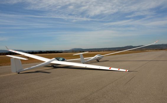 two white gliders in an aerodrome in south of France
