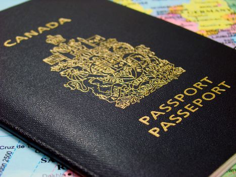 Photo of a Canadian passport against map.