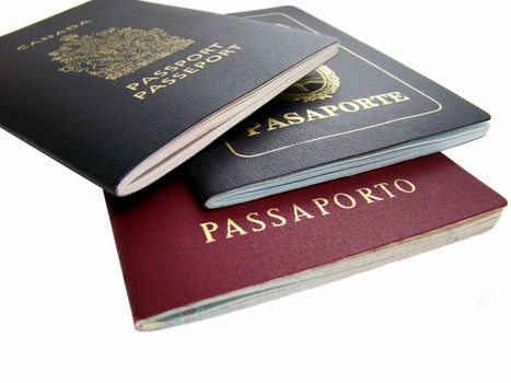 Passports of different countries. Word "passport" in four different languages: English, French, Spanish and Italian.