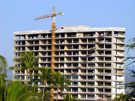 Crane. Apartment building under construction in Mexico.