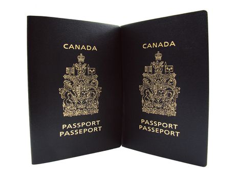 Two Canadian passports, bilingual  English and French.