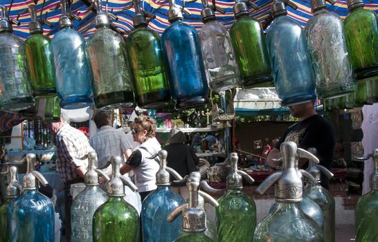 People walking through the San Telmo in market seen through Soda Syphons for sale in 10th October 2009.