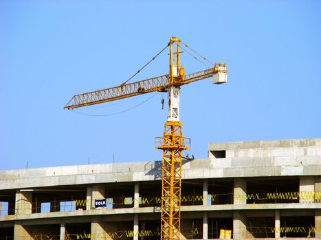 Crane. Apartment building under construction in Mexico.