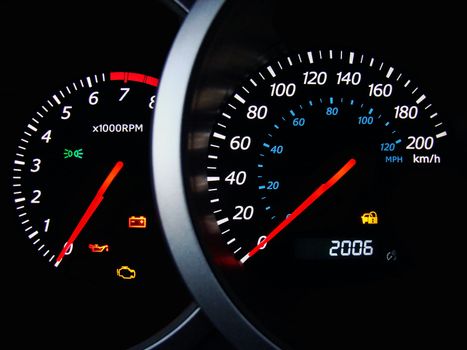 Close up of car dashboard gauges.