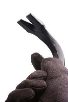 The hand in a black glove made of cloth holds crowbar.