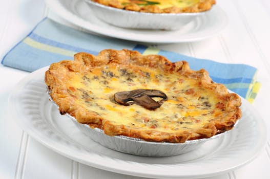 Delicious homemade quiche with cheese and mushrooms.