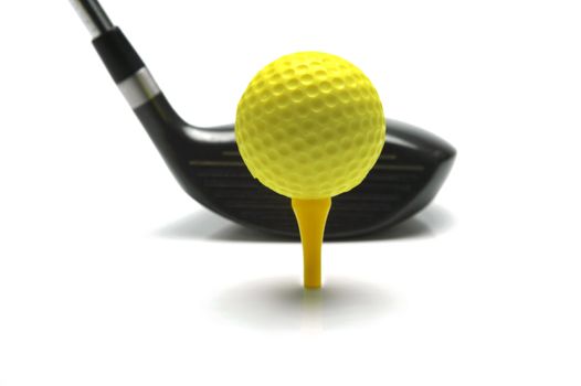 Golf ball and a golf club isolated against a white background