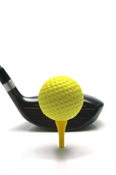Golf ball and a golf club isolated against a white background