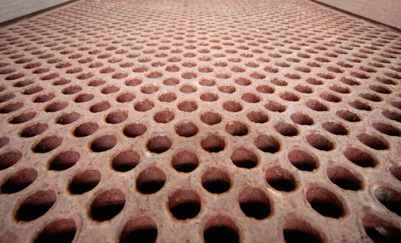 Rusty metal lattice close up - the heat exchanger