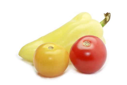 Fresh ripe paprica, red and yellow cocktail tomatoes isolated on white