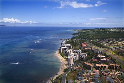 Aerial view of buildings on coastline of Maui, Hawaii.