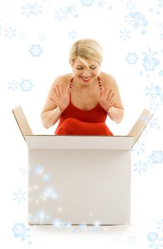 happy girl with blank box surrounded by rendered snowflakes