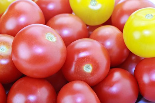 Fresh ripe red and yellow cocktail tomatoes isolated on white