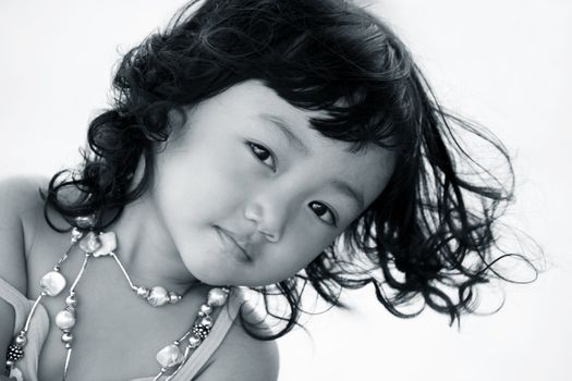 Portrait of the beautiful small Asian girl.  Indonesia. Java