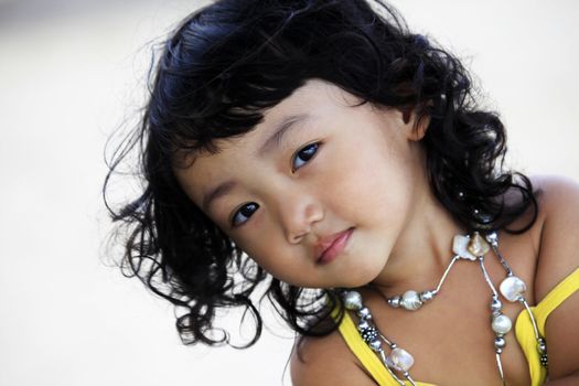 Portrait of the beautiful small Asian girl.  Indonesia. Java