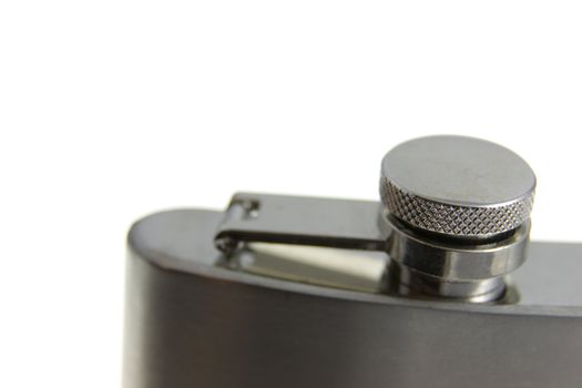 A close up of a metal flask.