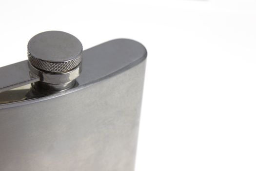 A close up of a metal flask.

