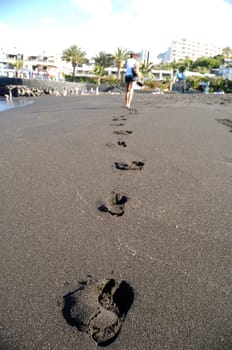 Footprints on the beach.