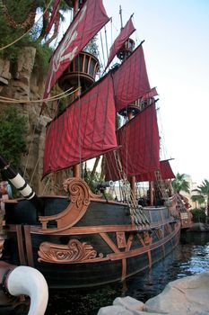 A black and red pirate ship one water
