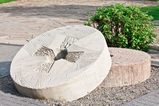 Decorative carved millstones in the park