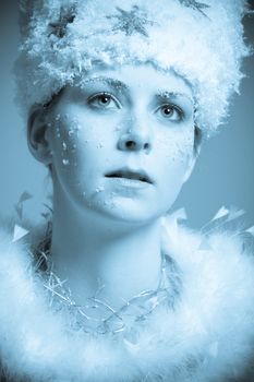 Beautiful girl with an icy look in blue tones
