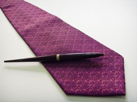 A white name card on a purple tie, on a white background
