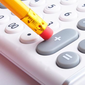 calculator showing business accounting concept in white
