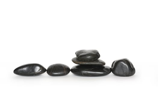 Few black stones isolated on white background with clipping path
