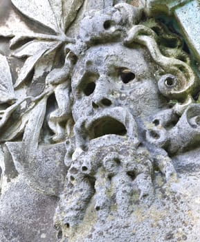 An image of an old grunge stone face