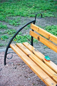 Lost toy lorry on the bench in park