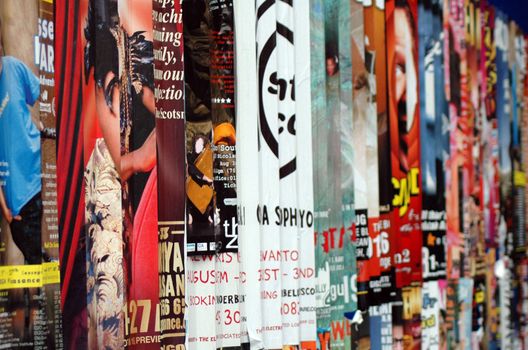 Publicity posters on a street wall