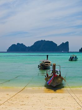 Traditional Thai longtail boats on a bay in Koh Phi-Phi Don, Thailand