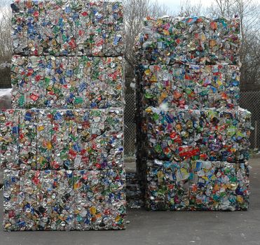 Bales of cans waiting to be recycled at recycling plant