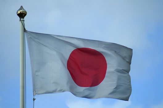 Flag of Japan flying on a flagpole