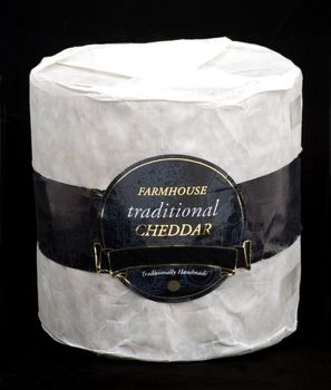 A whole cheddar cheese matured in caves in Somerset England