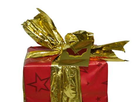 Close up of the top of a Christmas present wrapped in gold ribbon