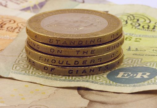 A stack of UK �2 coins showing quote from Isaac Newton