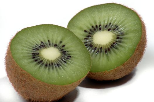A fresh Kiwi fruit cut into two halves