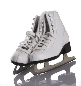 Figures skates on white and ice background