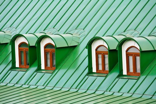 Roof dormers on the roof covered with green iron plates (the Kiev-Pecherskaya Lavra monastery, Kiev, Ukraine)