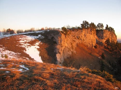 Vegetation; rocks; a relief; a landscape; a hill