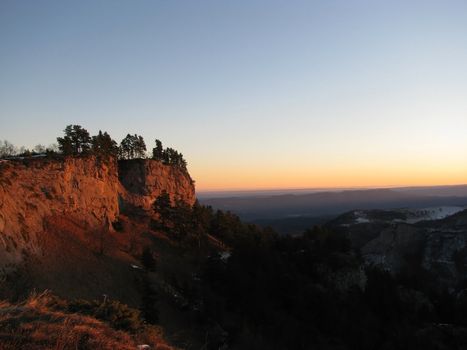 Vegetation; rocks; a relief; a landscape; a hill; a panorama; mountains