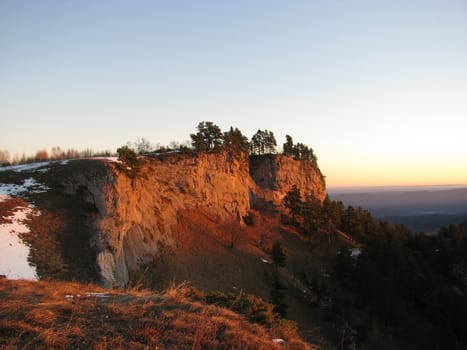 Vegetation; rocks; a relief; a landscape; a hill; a panorama; mountains