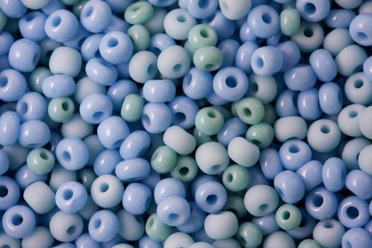 macro shot of small, blue and grean, glass beads - background